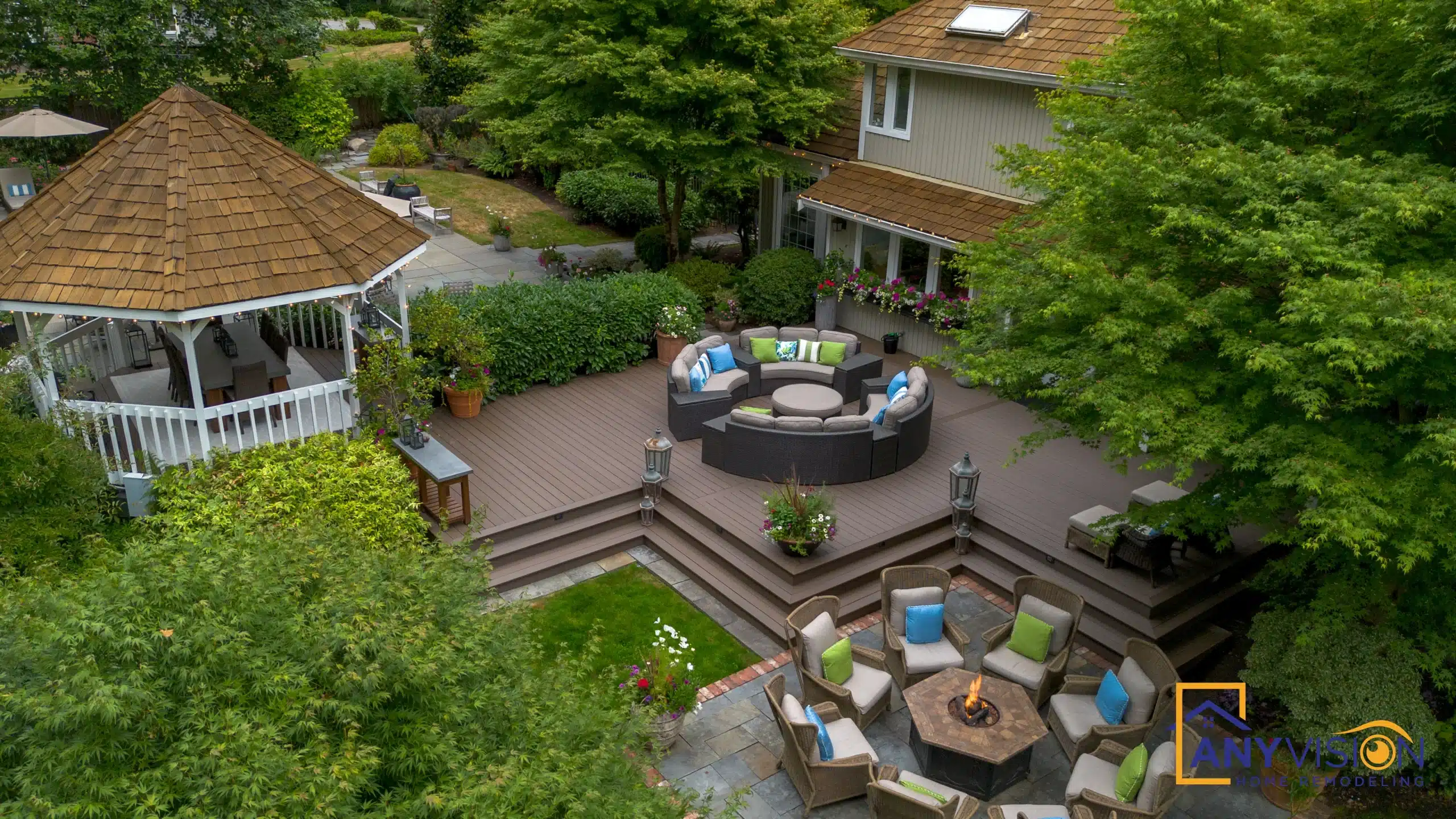 Elevated view across the deck levels and the fire-pit lounge