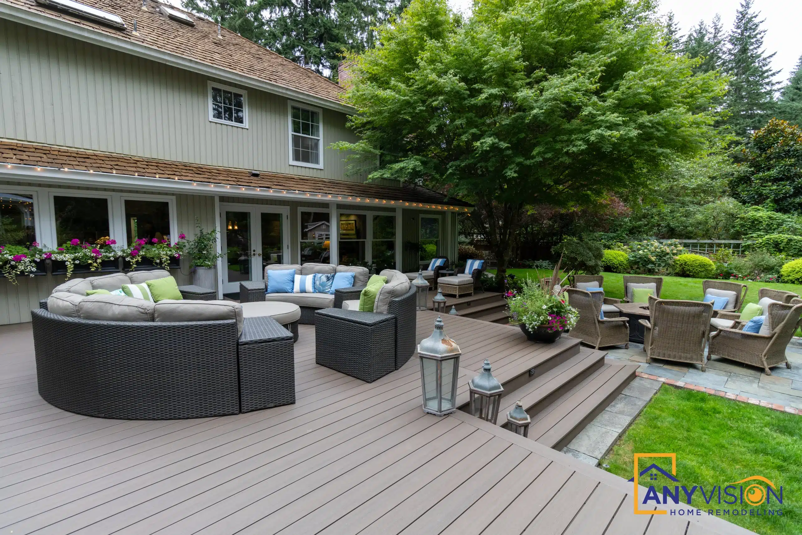 Deck stairs and dining terrace against the rear of the house
