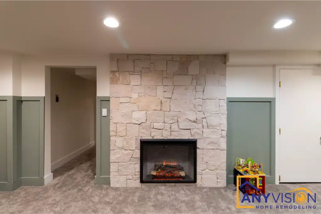 Finished lower level with custom stone fireplace from an Anyvision basement transformation in Seattle