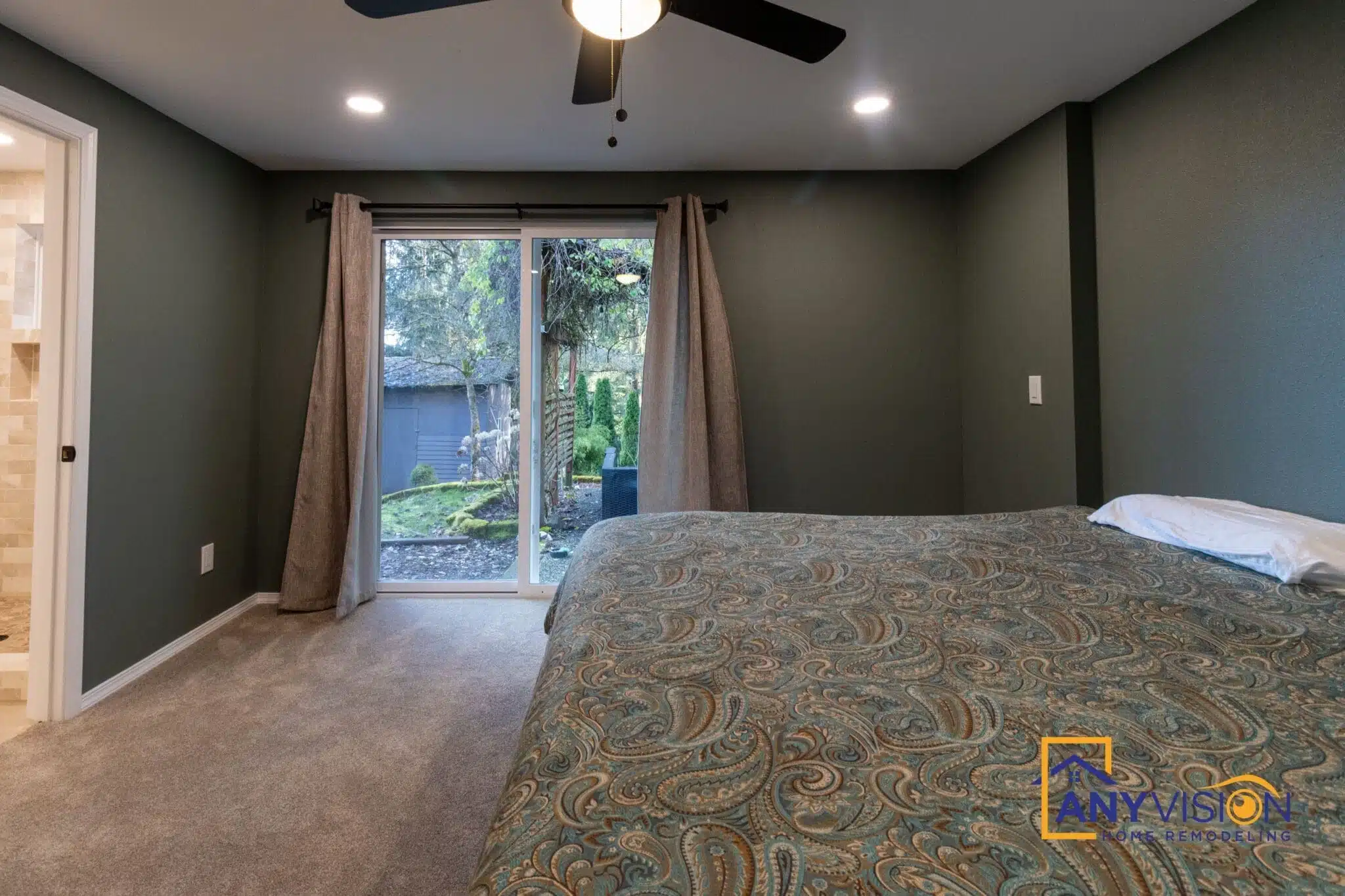 New primary bedroom with a sliding door opening directly onto the garden