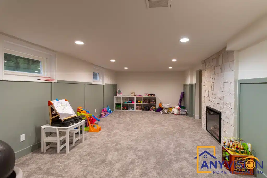 Open basement living area with a stone fireplace and space for family use